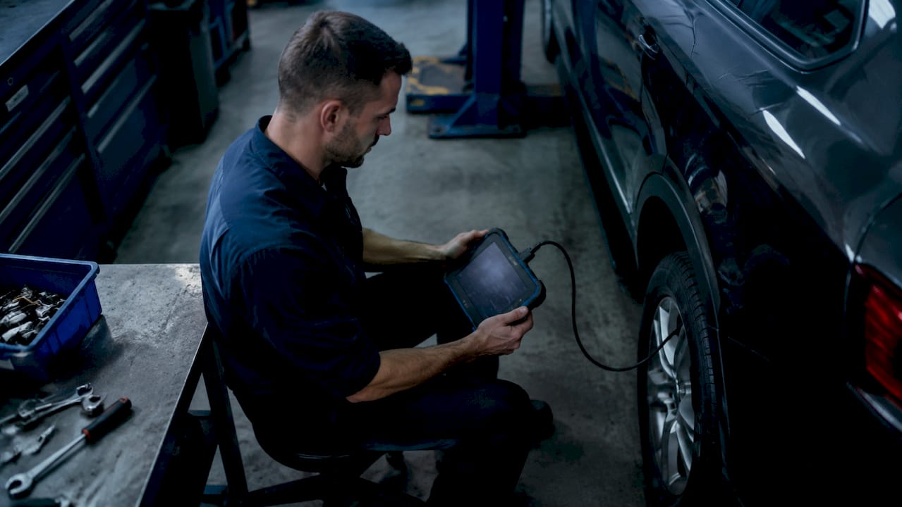 Technician tuning Haldex controller on AWD vehicle