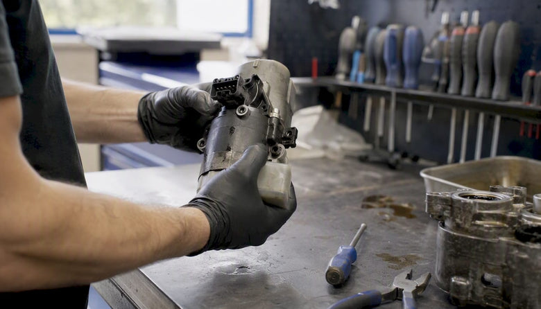 Technician handling Haldex electric pump